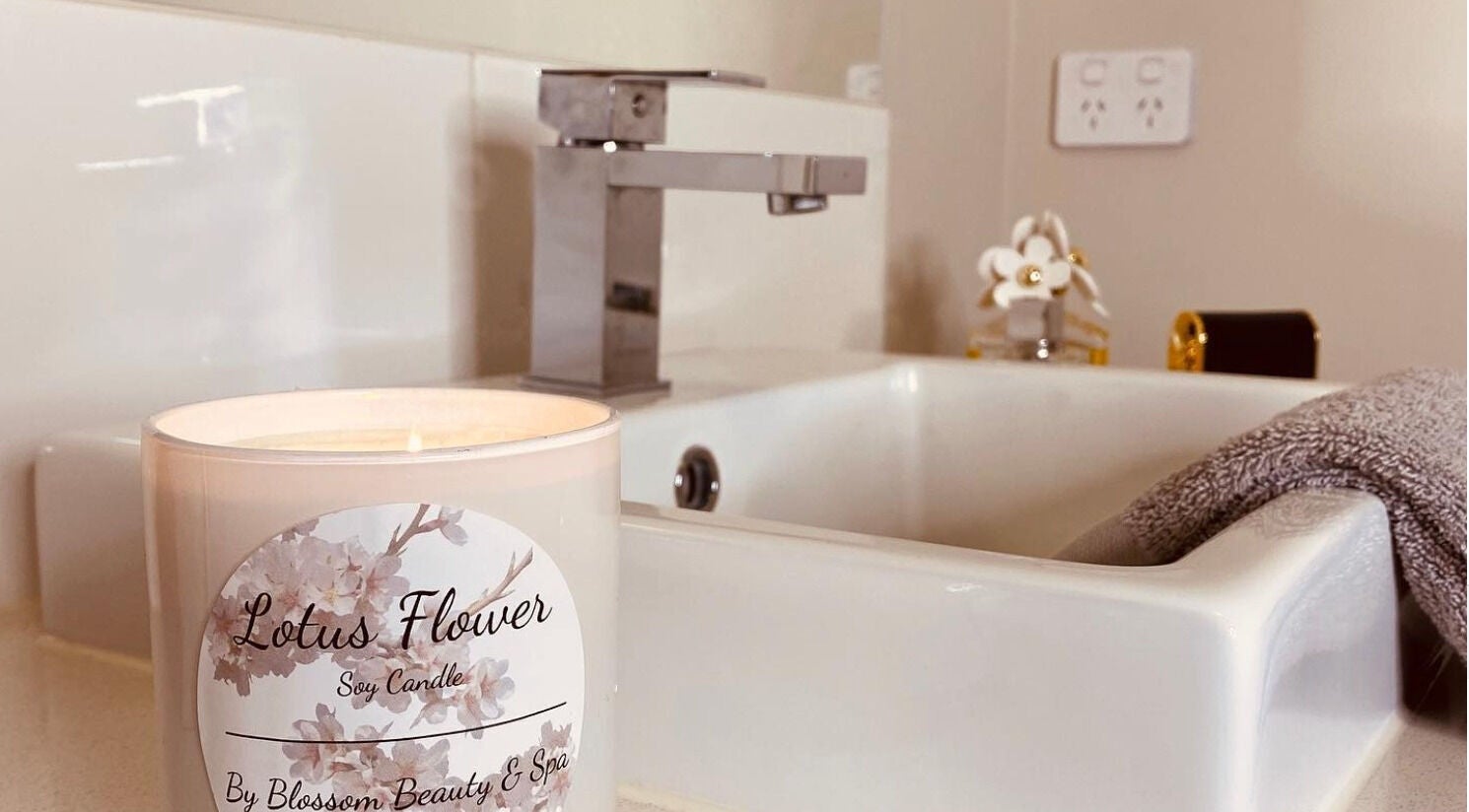 Lotus Flower candle by Blossom Beauty and Spa, Aintree, Victoria, AU, enhancing a serene bathroom atmosphere.