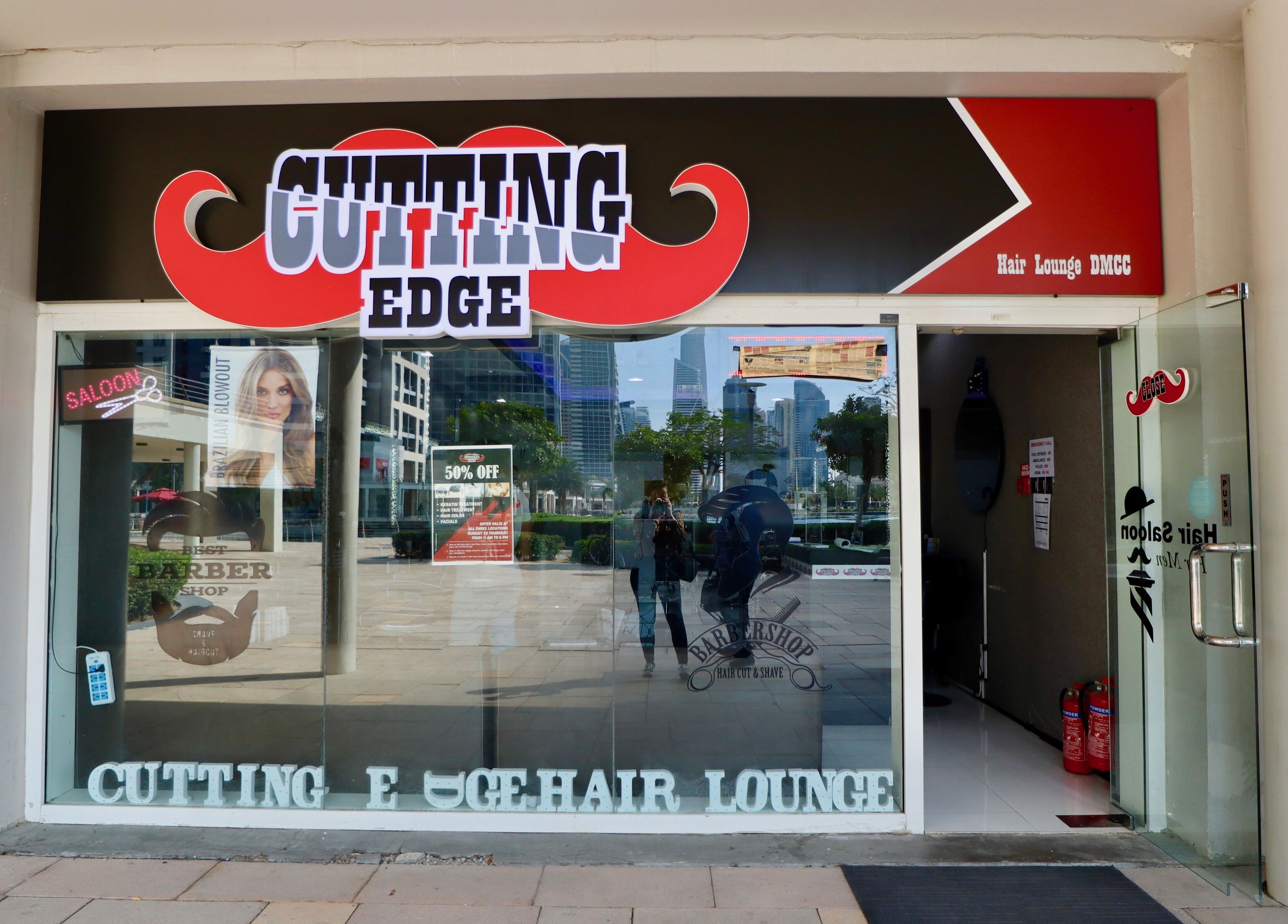 Entrance of Cutting Edge Gents Salon | Cluster T, featuring stylish signage in Dubai, AE.