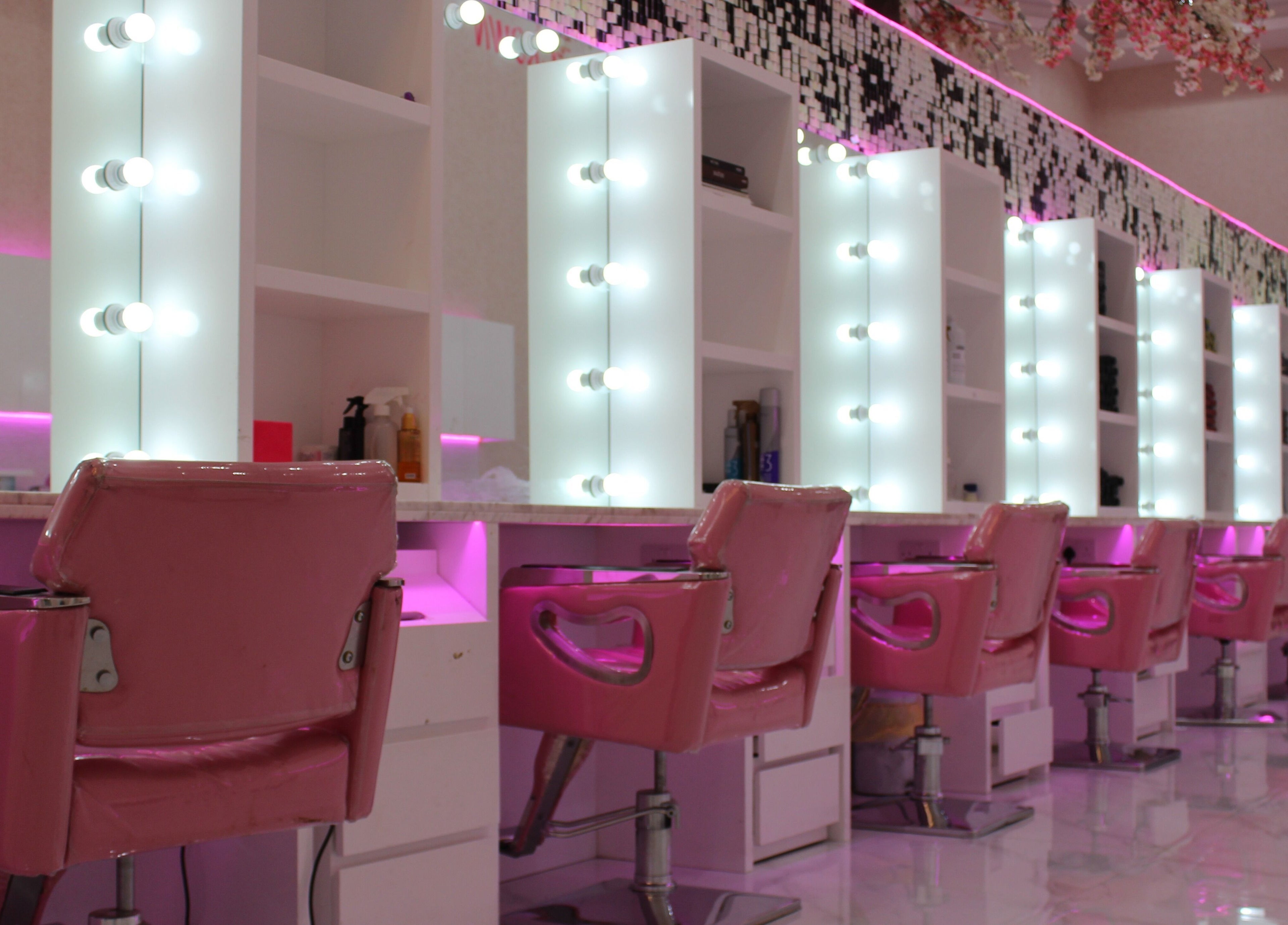 Vibrant salon interior with pink chairs at Cutting Edge Salon & SPA, Silicon Central Mall, Dubai, Dubai, AE.