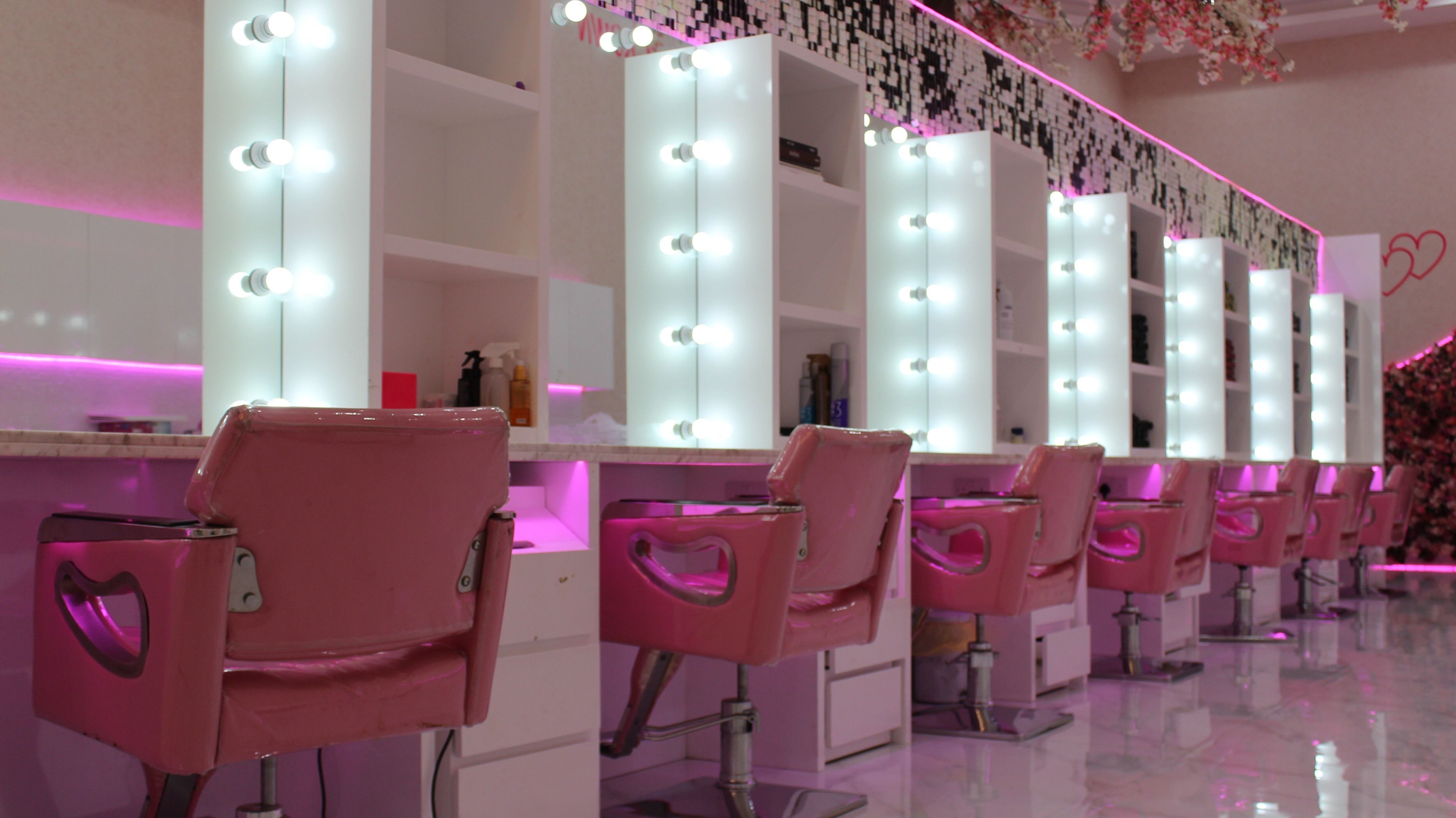 Vibrant salon interior with pink chairs at Cutting Edge Salon & SPA, Silicon Central Mall, Dubai, Dubai, AE.