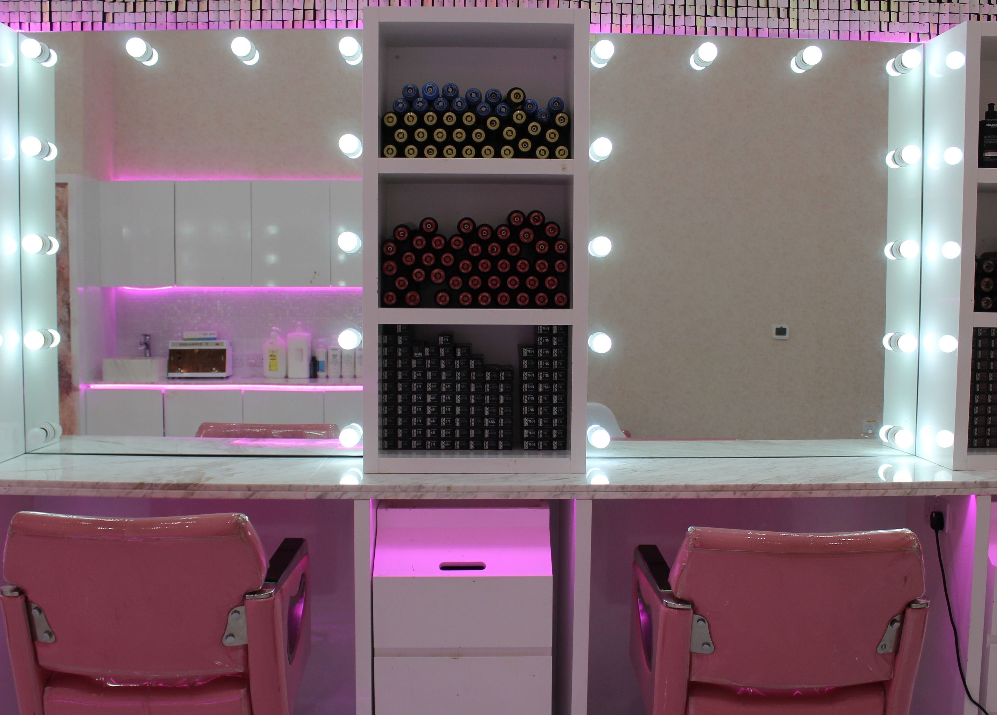 Elegant styling station at Cutting Edge Salon & SPA | Silicon Central Mall, Dubai, Dubai, AE with pink accents.