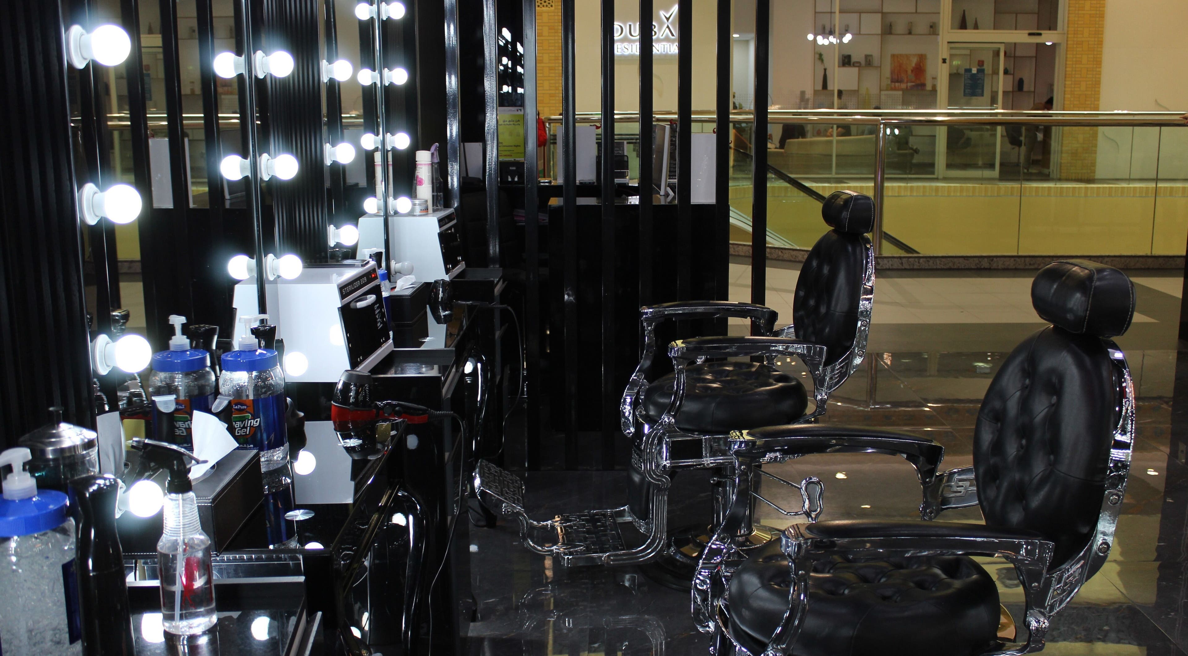 Cutting Edge Gents Salon | IBN Battuta Mall, Dubai, AE: Sleek barber chairs with illuminated mirrors.