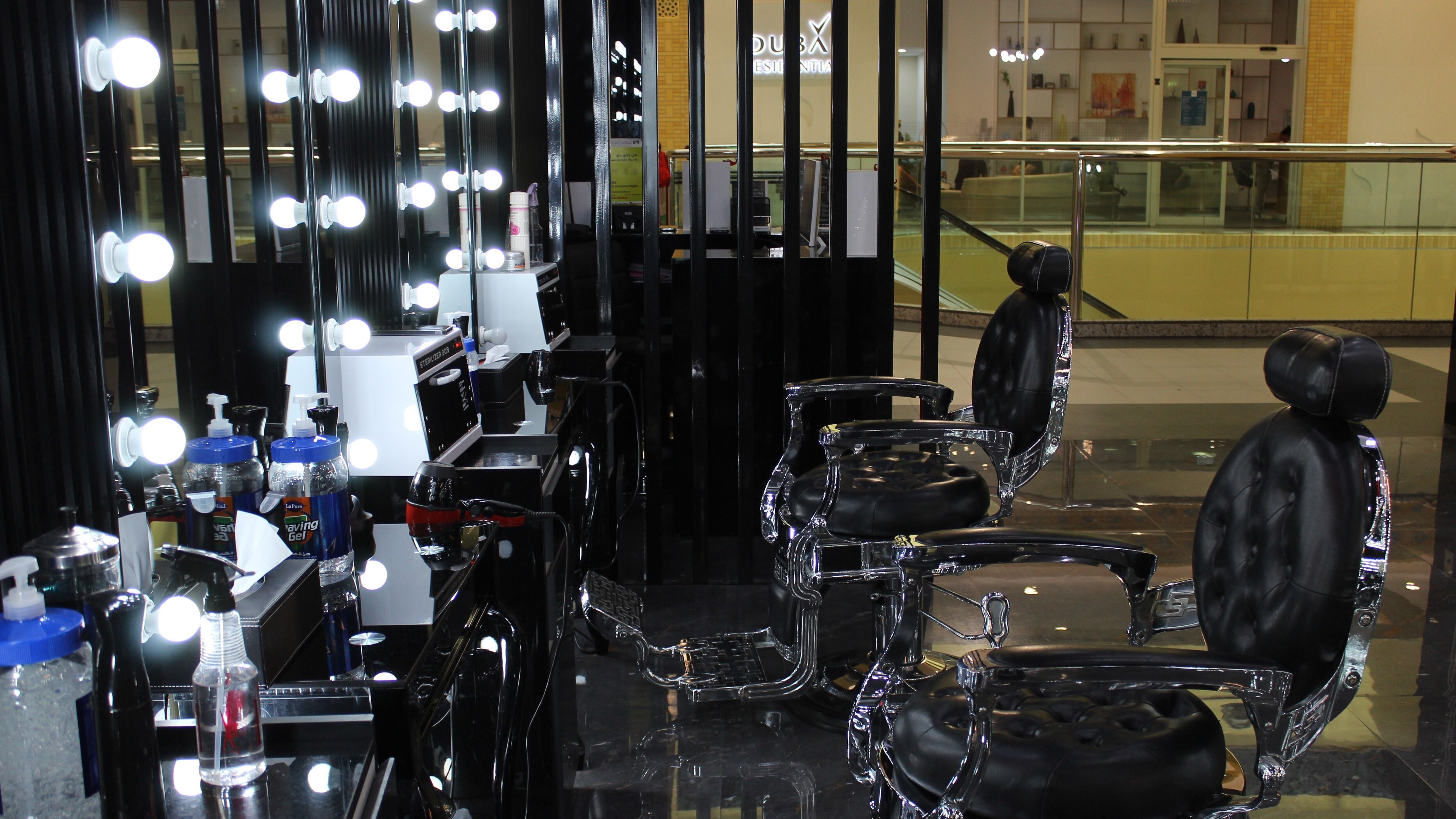 Cutting Edge Gents Salon | IBN Battuta Mall, Dubai, AE: Sleek barber chairs with illuminated mirrors.