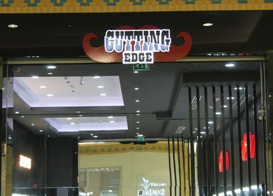 Entrance of Cutting Edge Gents Salon | IBN Battuta Mall, Dubai, AE, showcasing modern interiors.