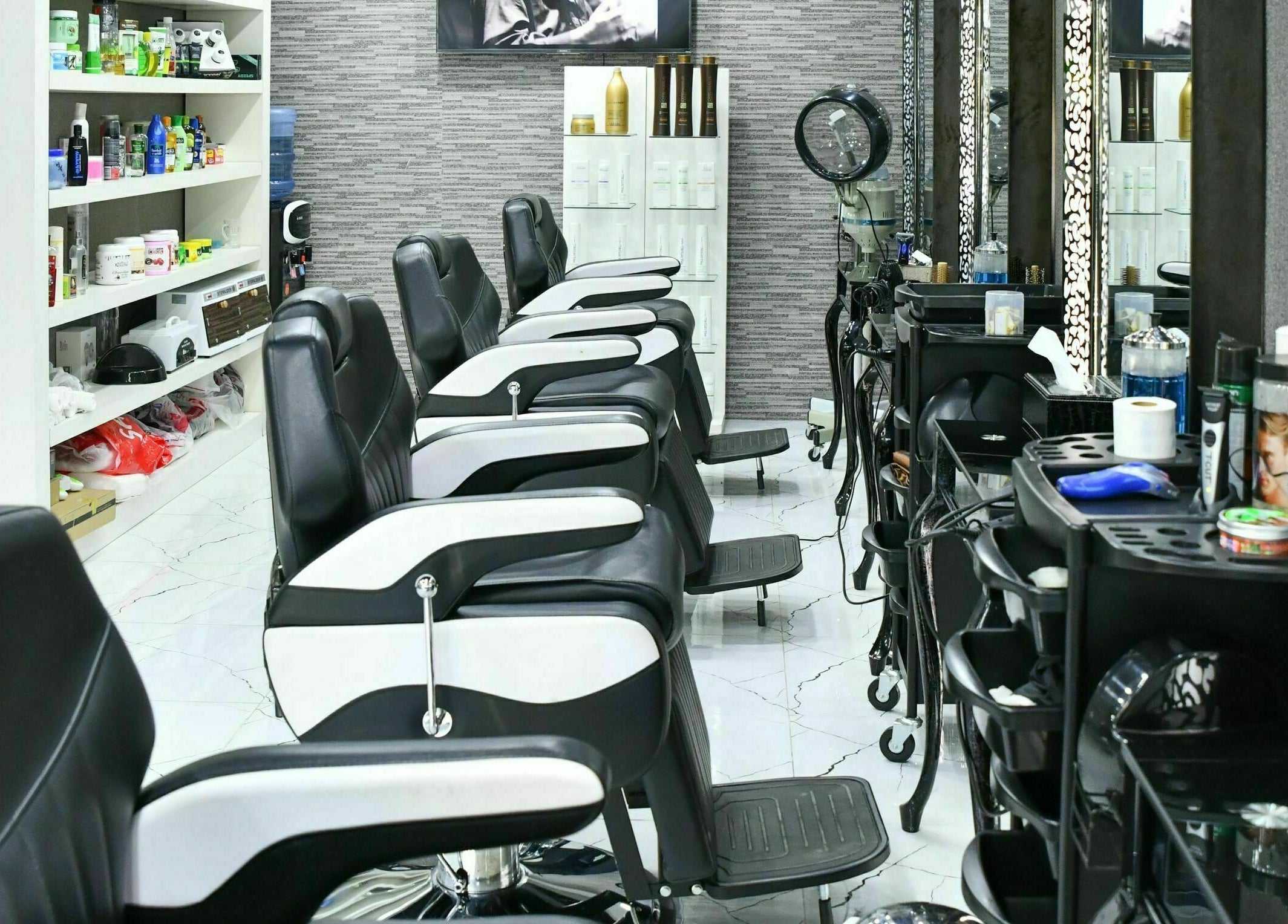Modern barber chairs at Cutting Edge Gents Salon | Cluster B, Dubai, AE with stylish decor.