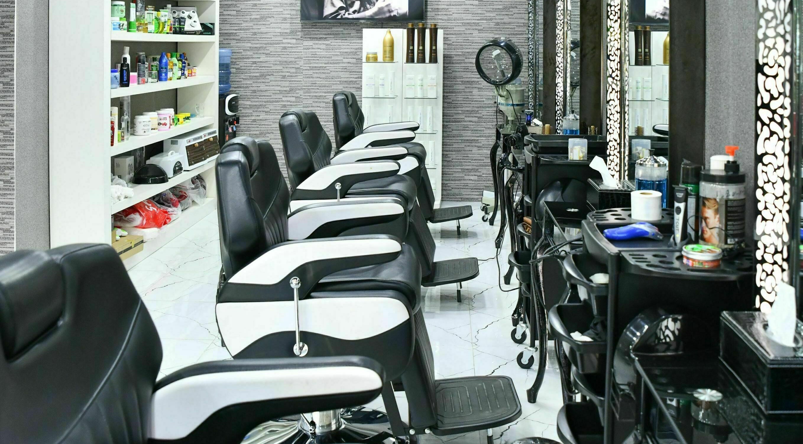 Modern barber chairs at Cutting Edge Gents Salon | Cluster B, Dubai, AE with stylish decor.