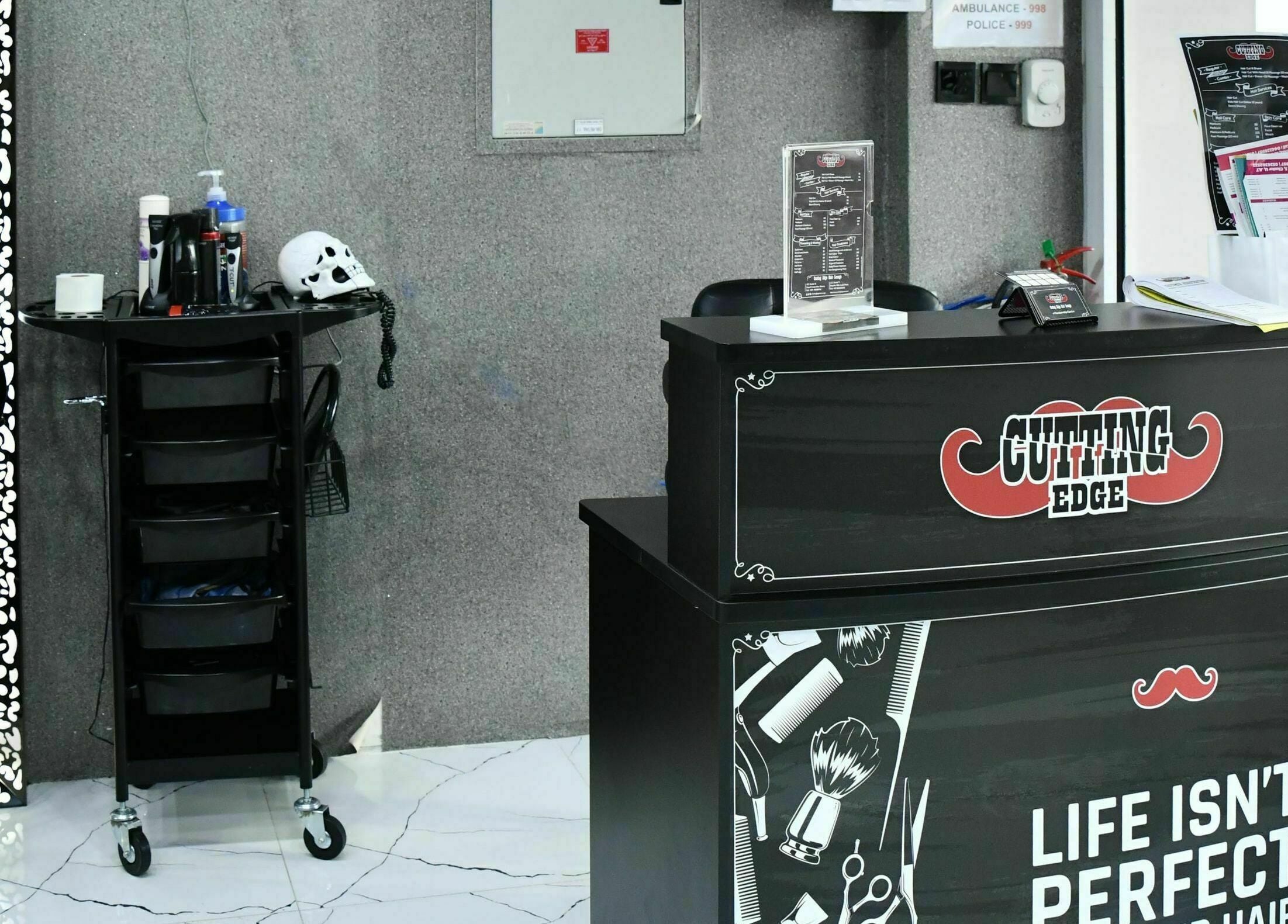 Reception at Cutting Edge Gents Salon | Cluster B, Dubai, AE showcasing modern decor and grooming tools.