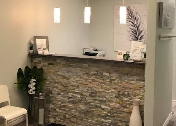 Welcoming reception at Clover Therapeutic Wellness Centre, Niagara Falls, Ontario, CA with modern decor.