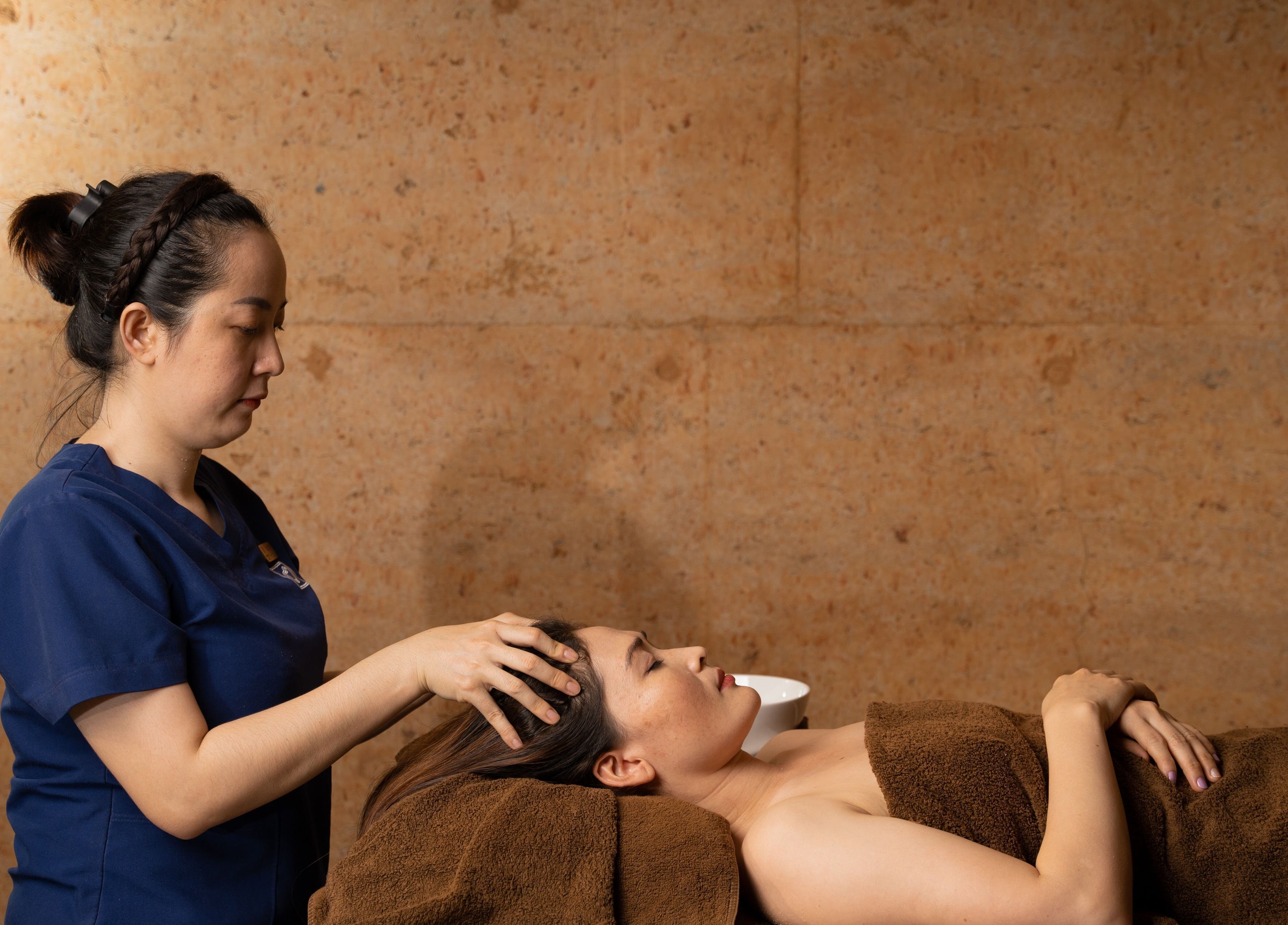 Relaxing head massage at Mango Bay Spa, Phú Quốc, Kiên Giang, VN, offering serene wellness experiences.