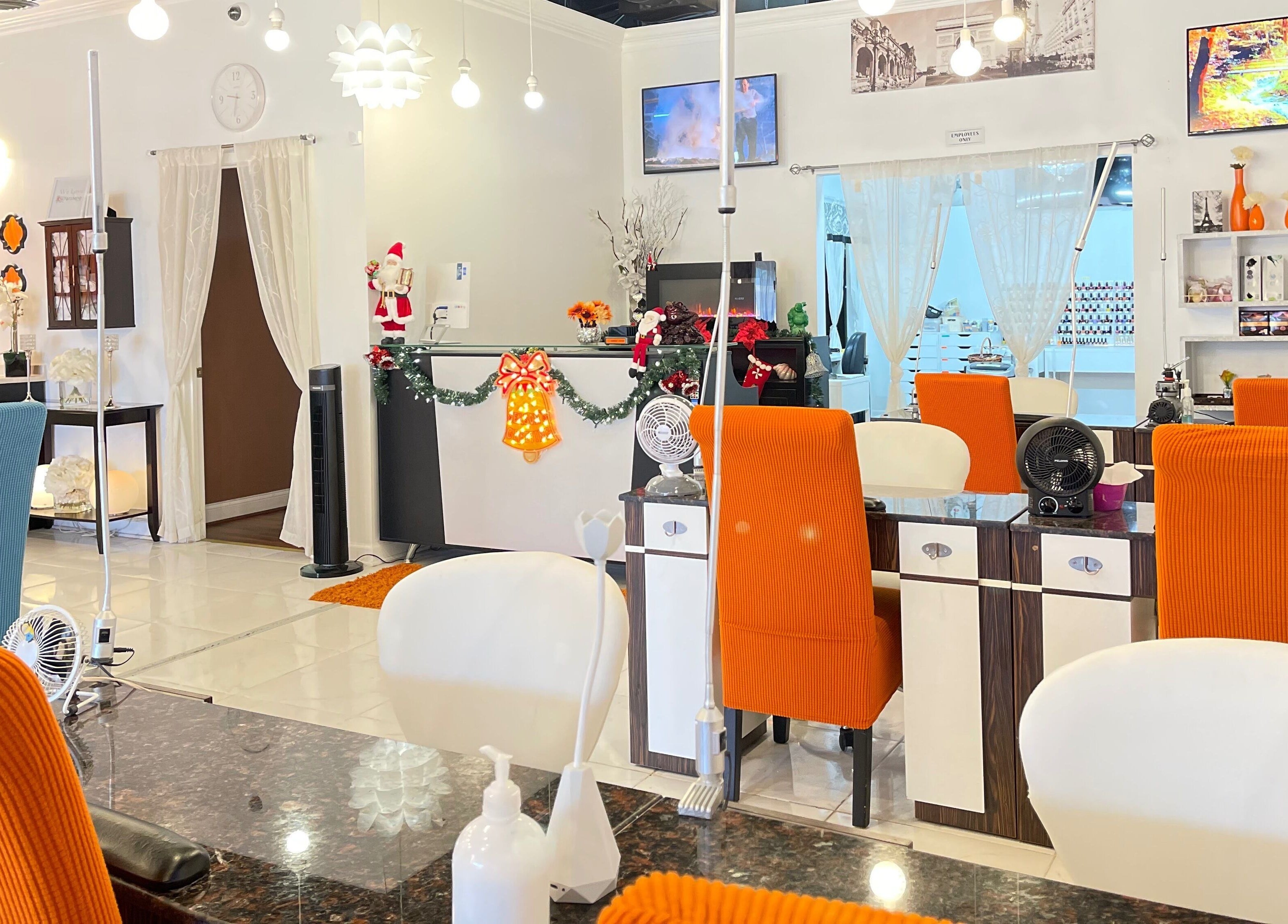 Interior of Together Nail Parlor in Suwanee, Georgia, US showcasing vibrant decor and seating.