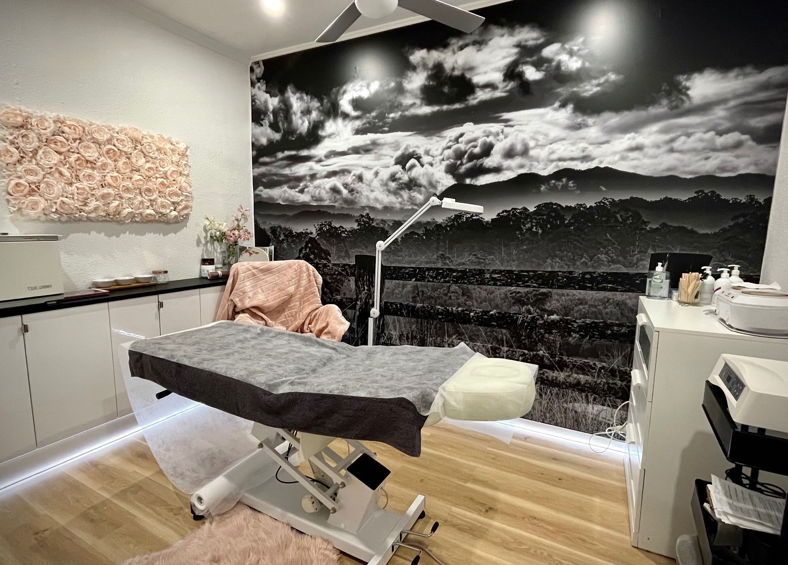 Relaxing treatment room at About Face Woopi, Woolgoolga, New South Wales, AU featuring serene decor.