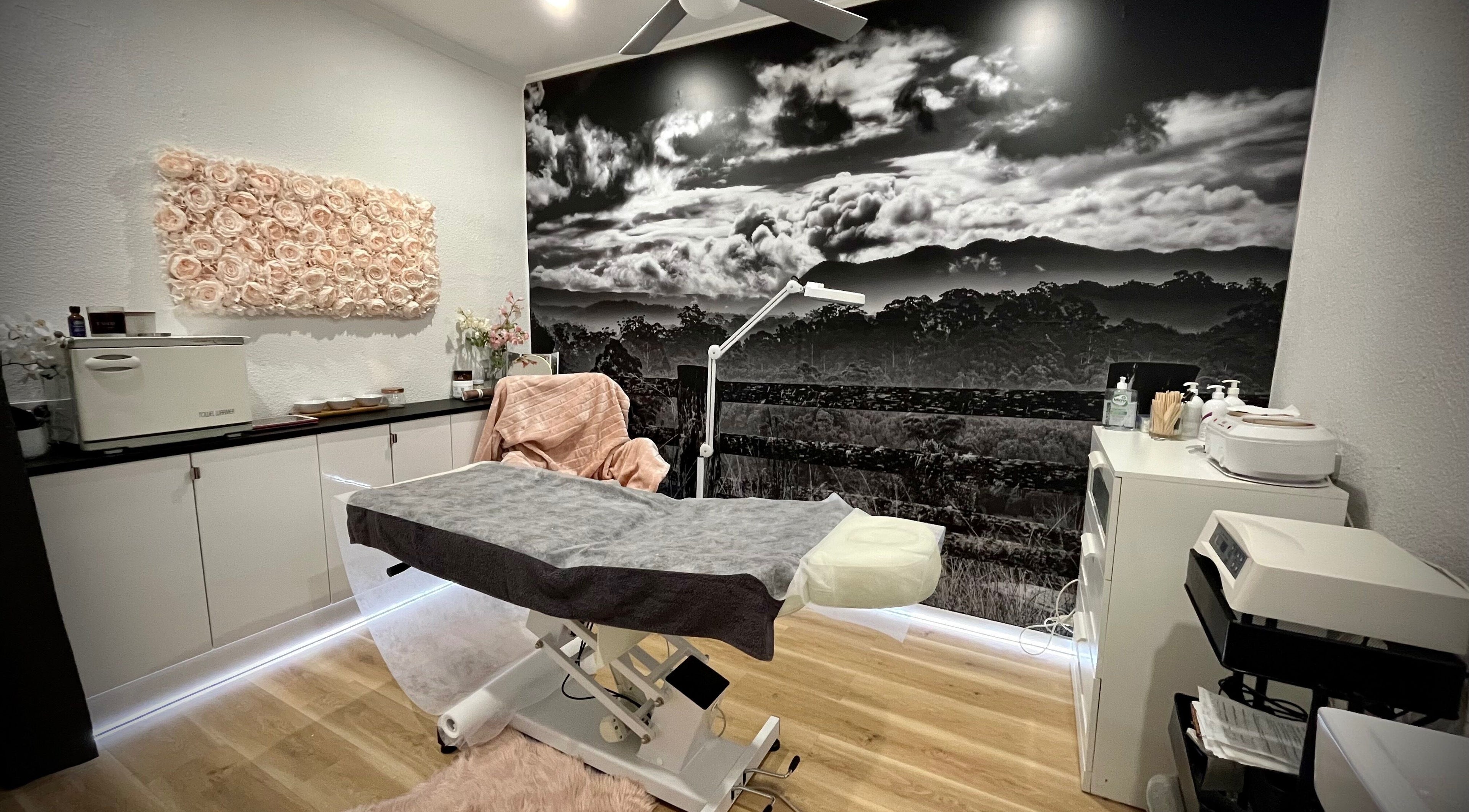 Relaxing treatment room at About Face Woopi, Woolgoolga, New South Wales, AU featuring serene decor.