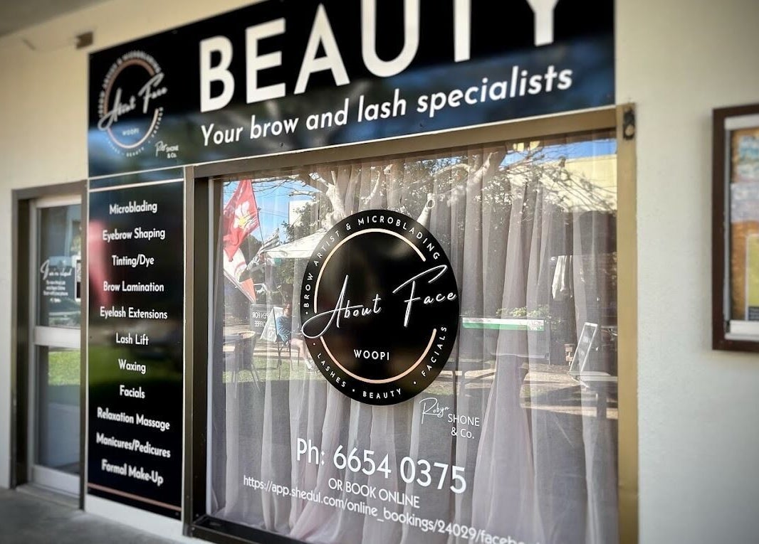 Exterior of About Face Woopi with signage, Woolgoolga, New South Wales, AU highlighting beauty services.