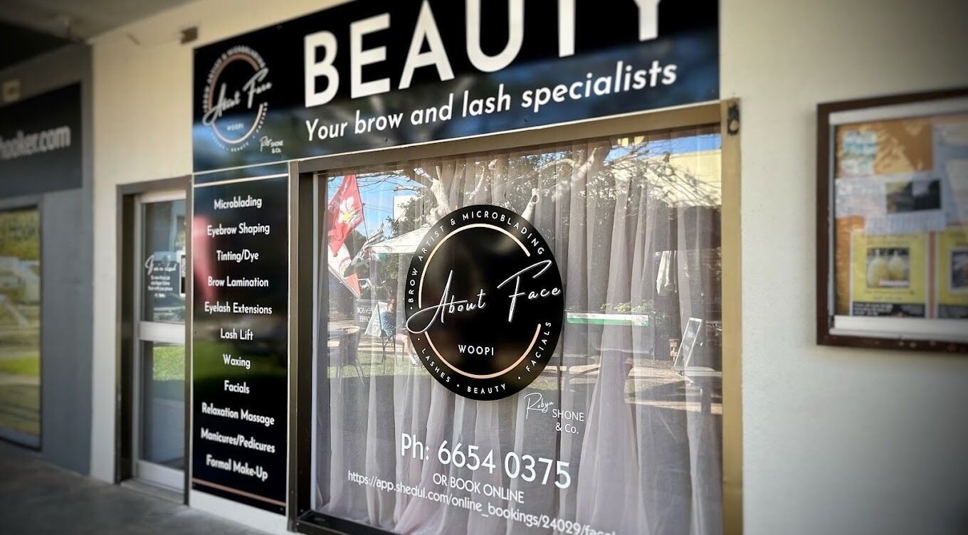 Exterior of About Face Woopi with signage, Woolgoolga, New South Wales, AU highlighting beauty services.