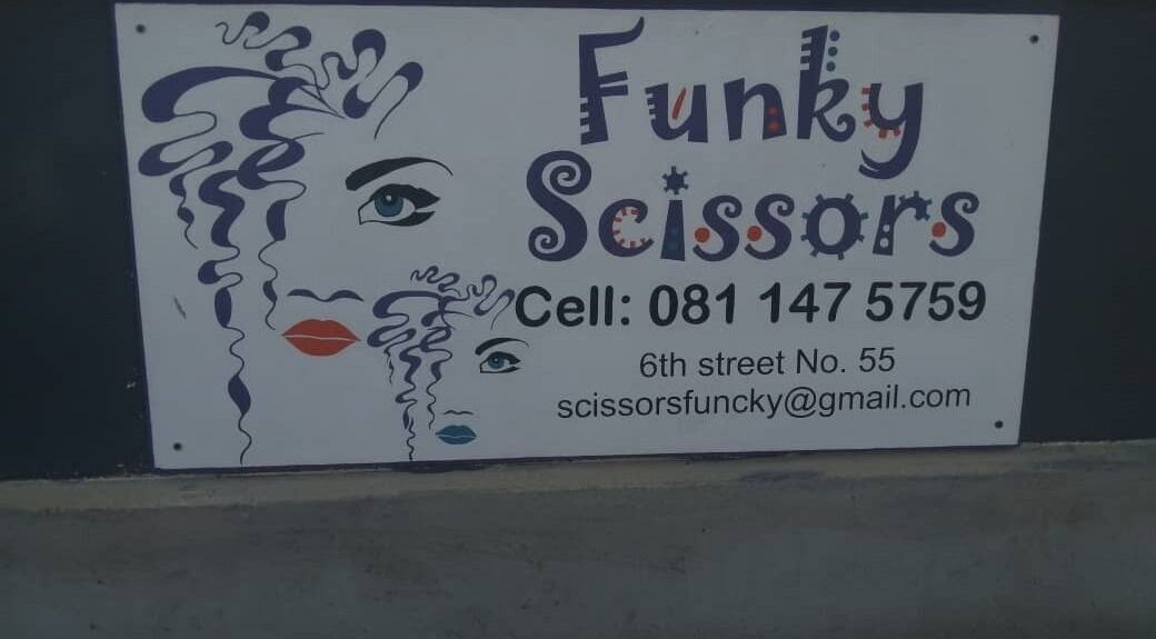 Funky Scissors signboard in Walvis Bay, Erongo Region, NA showing contact information and artistic design.