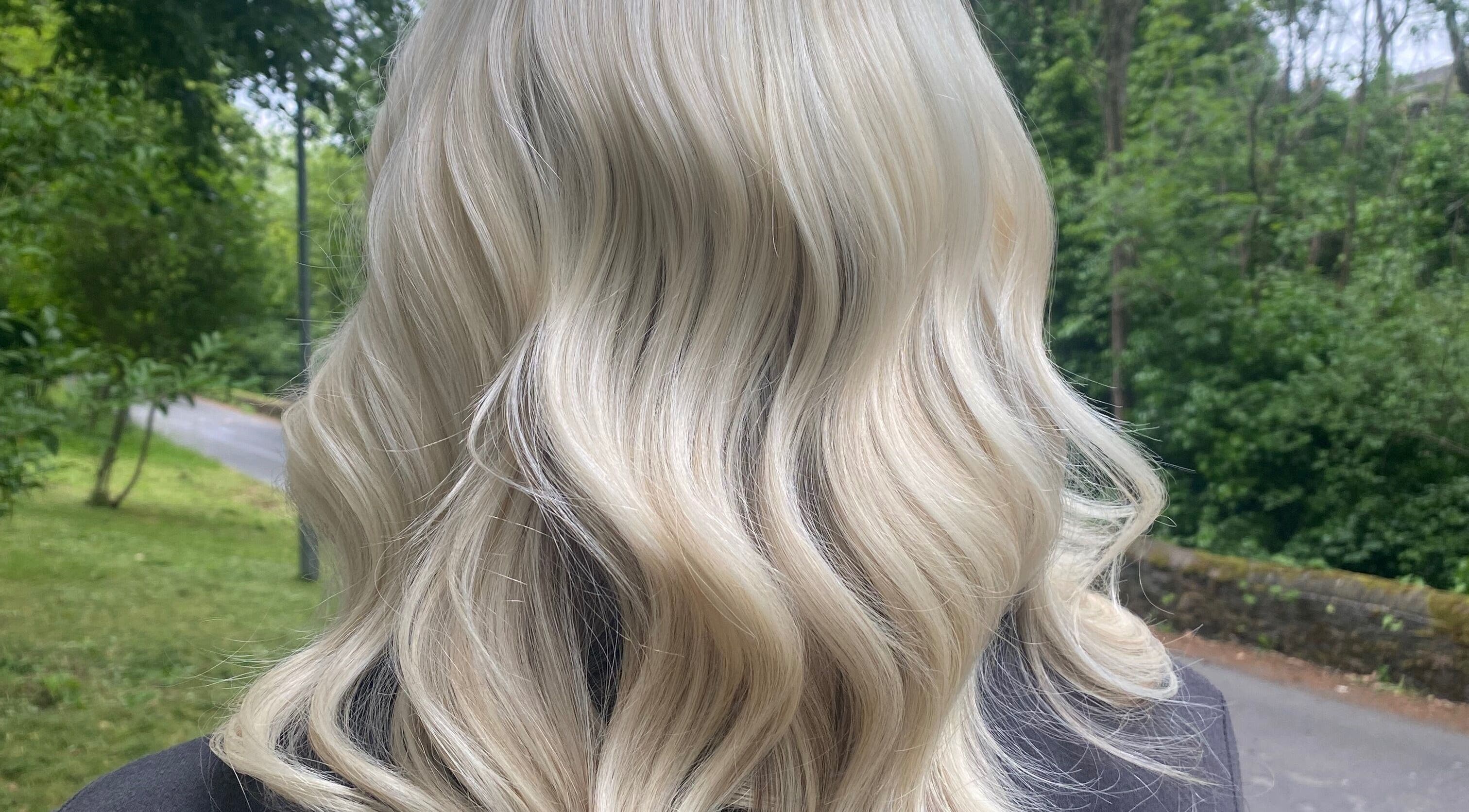 Blonde hair with soft waves styled at Kimberley Nash Hair in Shepley, England, GB.