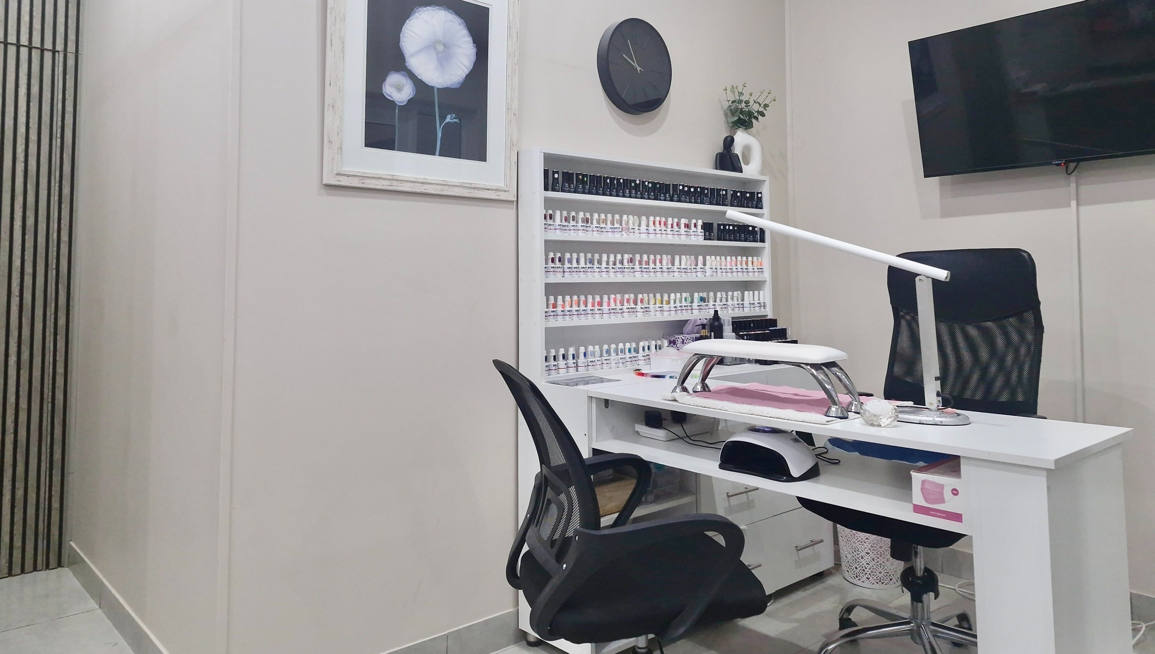 Nail salon workspace at NK Beauty & Aesthetics, Upington, Northern Cape, ZA, showcasing a modern, organized setup.