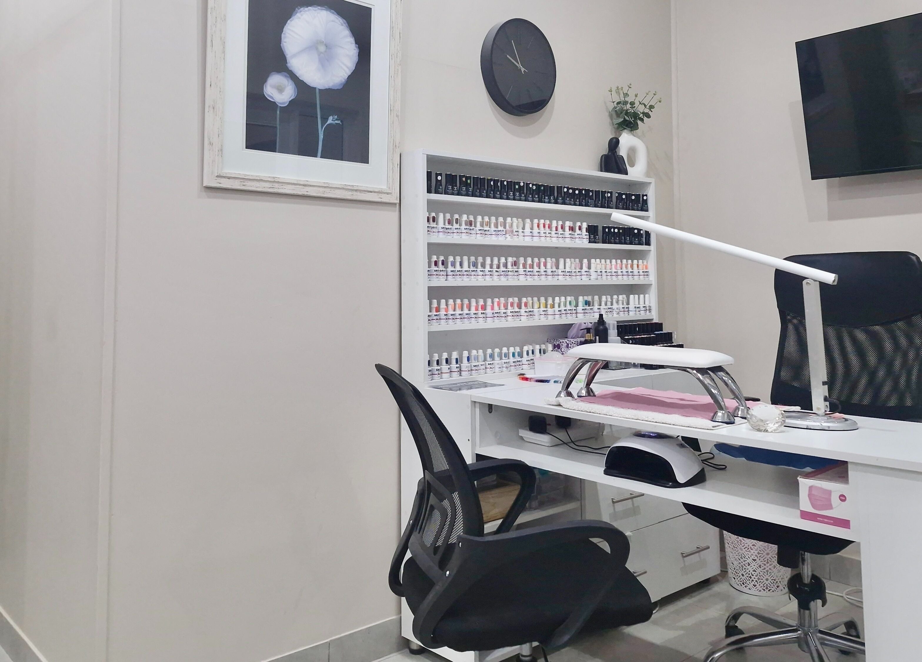Nail salon workspace at NK Beauty & Aesthetics, Upington, Northern Cape, ZA, showcasing a modern, organized setup.
