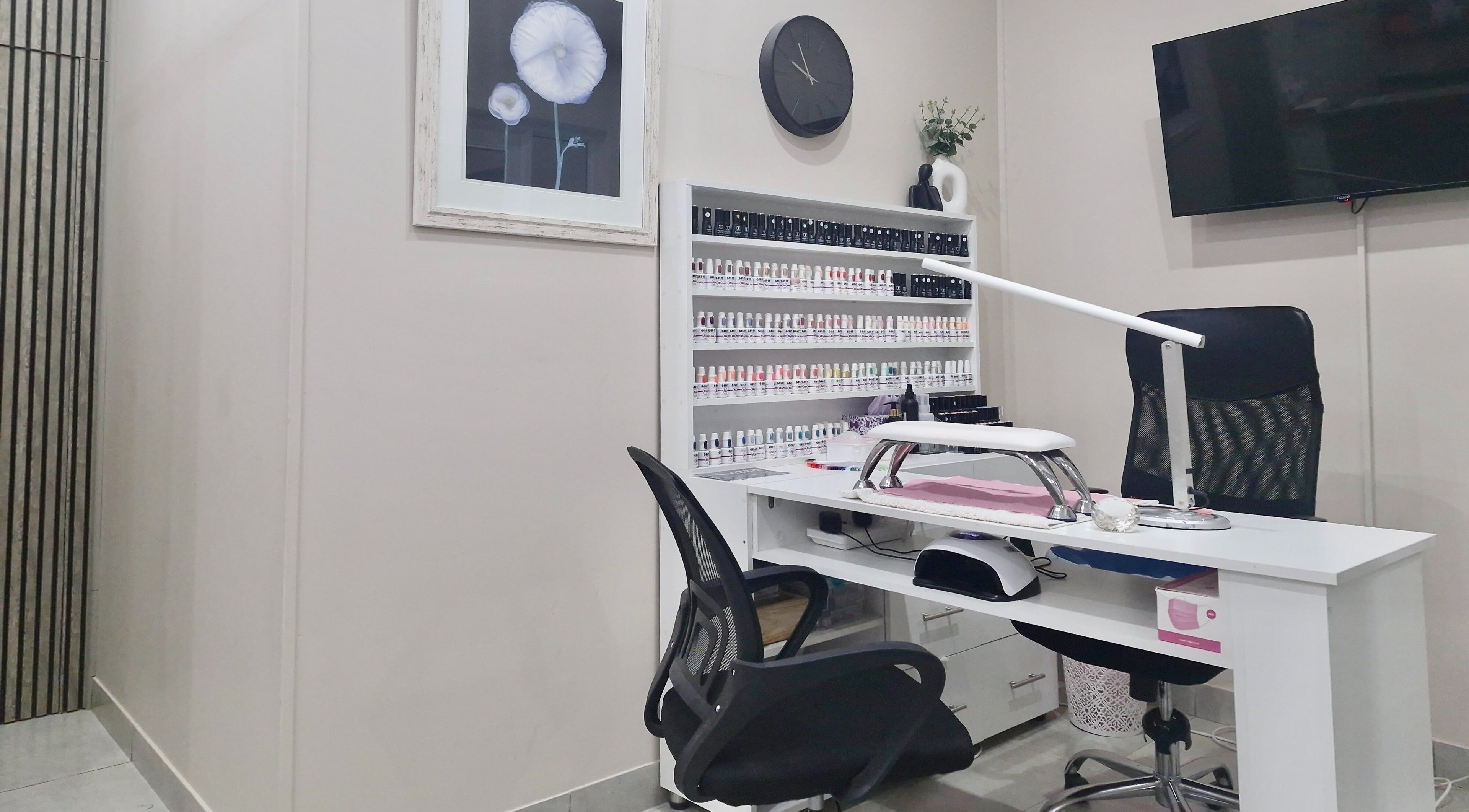 Nail salon workspace at NK Beauty & Aesthetics, Upington, Northern Cape, ZA, showcasing a modern, organized setup.