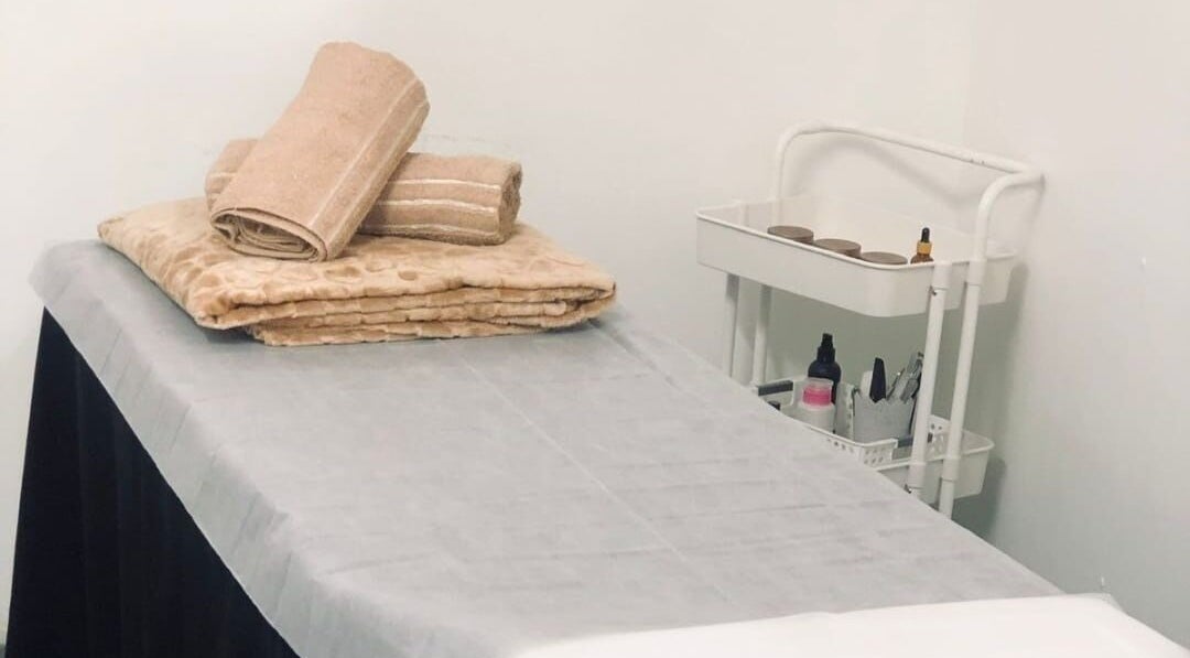 Massage bed with cozy linens at NK Beauty & Aesthetics, Upington, Northern Cape, ZA.