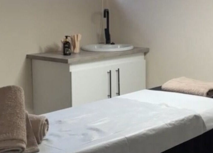Tranquil treatment room at NK Beauty & Aesthetics, Upington, Northern Cape, ZA, with a neatly prepared massage bed.