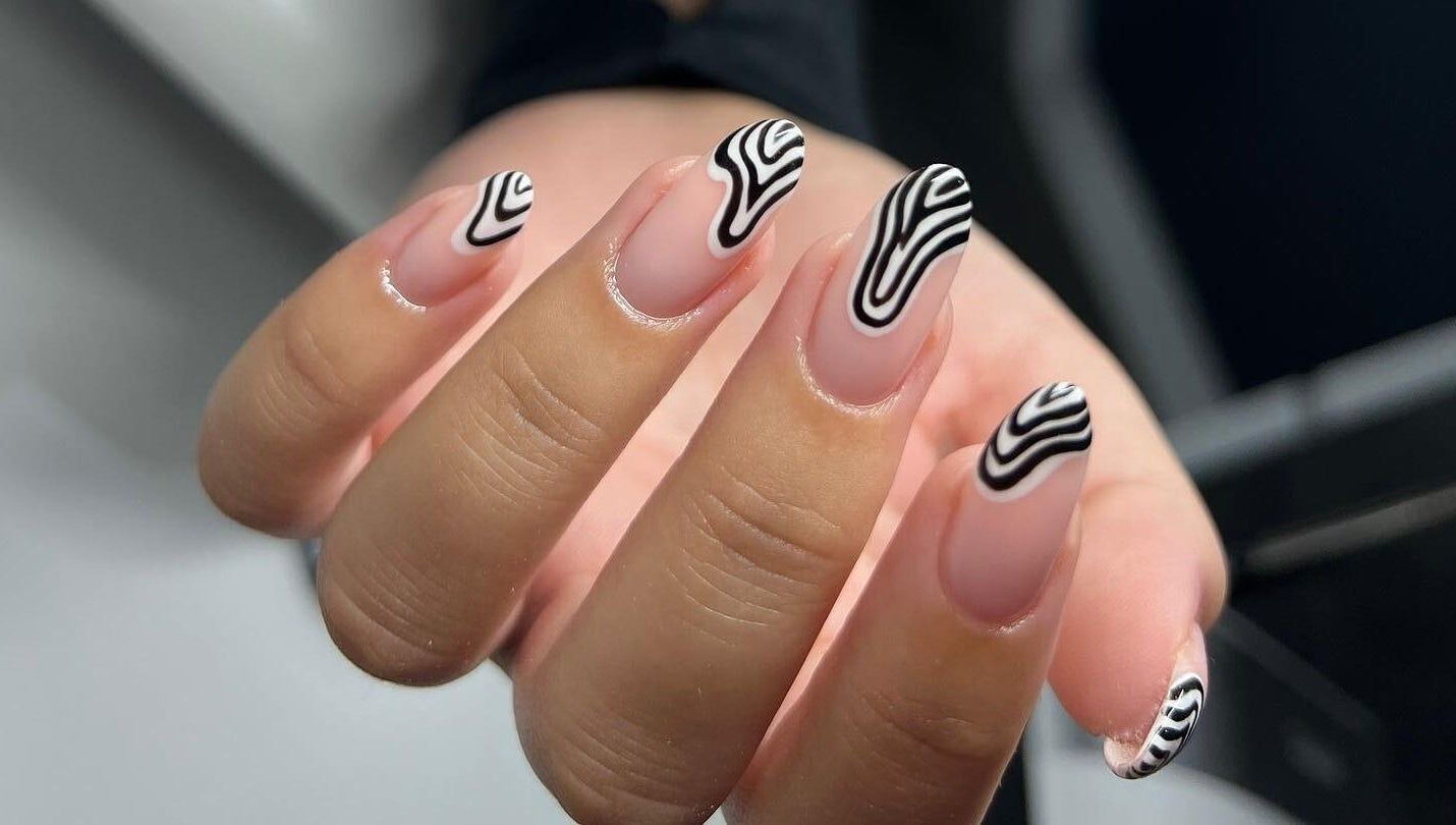 Stylish nail art by Abbey Mcskeane Nail Technician in Clydebank, Scotland, GB with black and white abstract design.