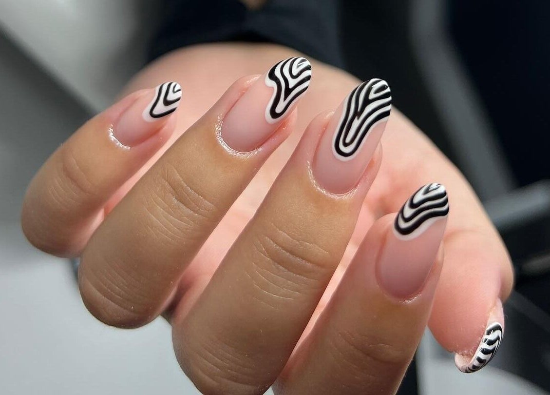 Stylish nail art by Abbey Mcskeane Nail Technician in Clydebank, Scotland, GB with black and white abstract design.