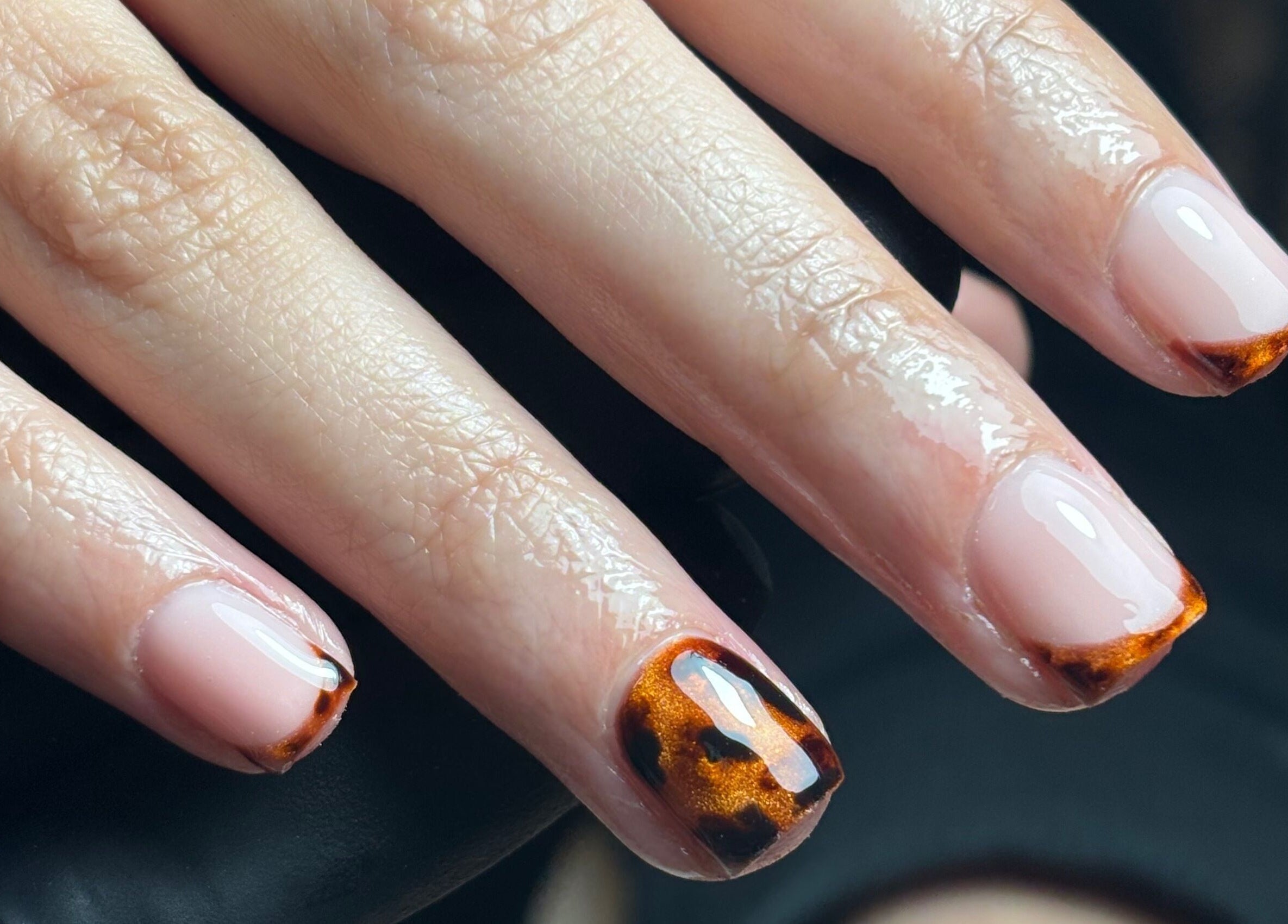 Elegant nail art design at Nails By Cait in Darwen, England, GB, featuring a tortoiseshell pattern on manicured nails.