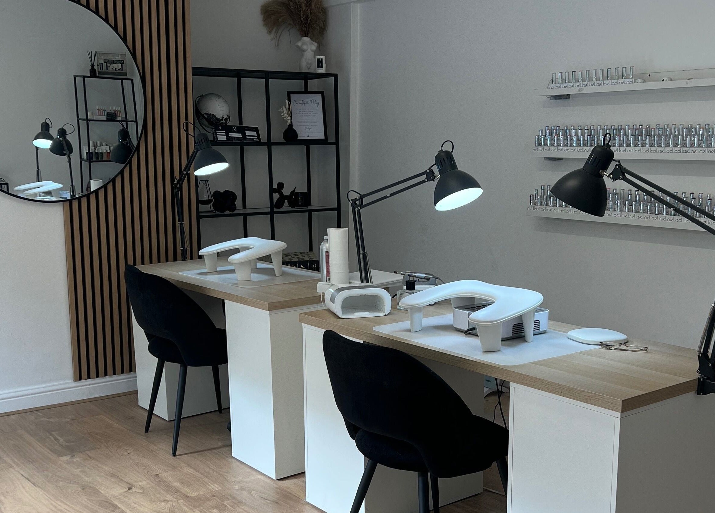 Chic nail salon interior at Nails By Cait in Darwen, England, GB, featuring modern stations and stylish decor.