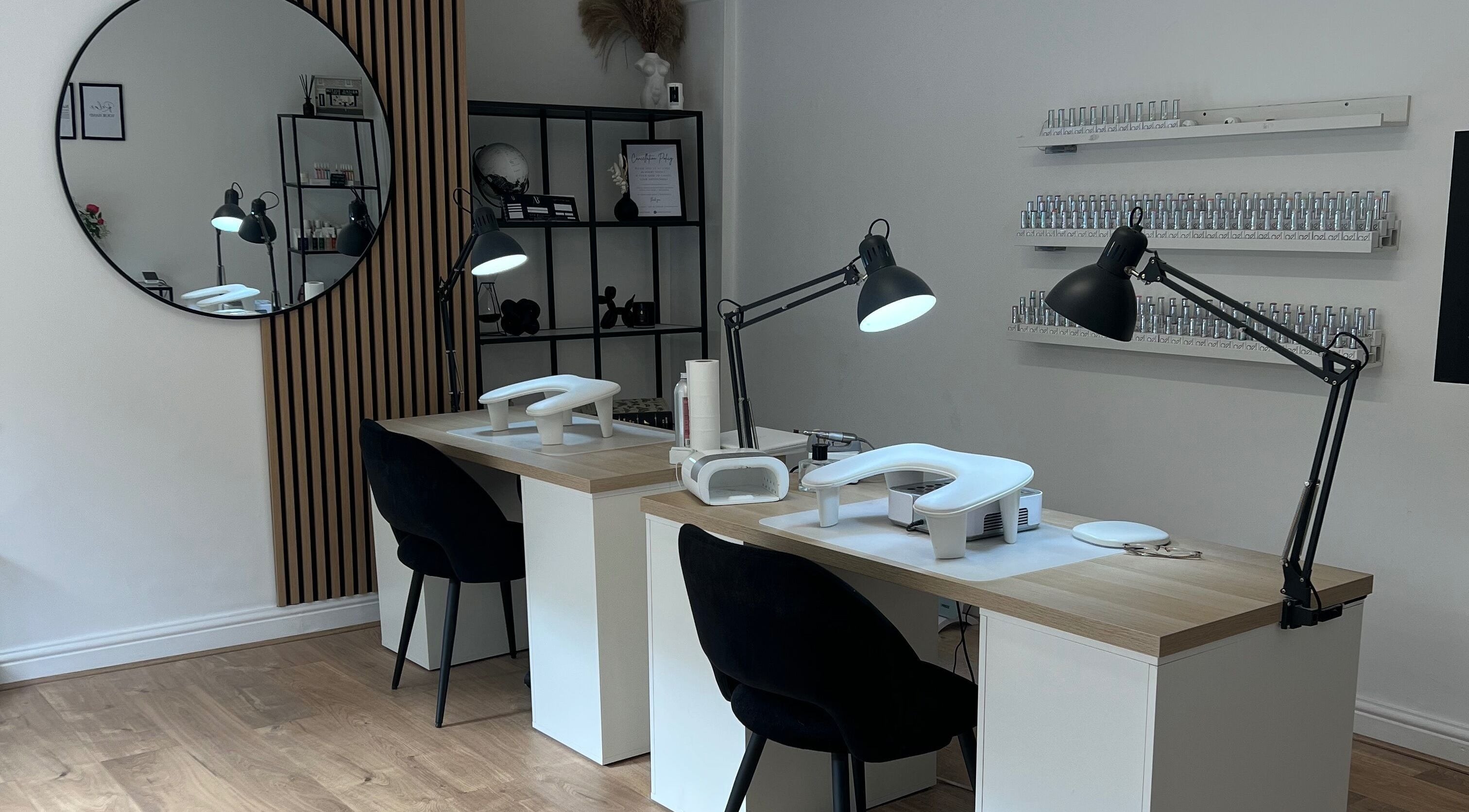 Chic nail salon interior at Nails By Cait in Darwen, England, GB, featuring modern stations and stylish decor.