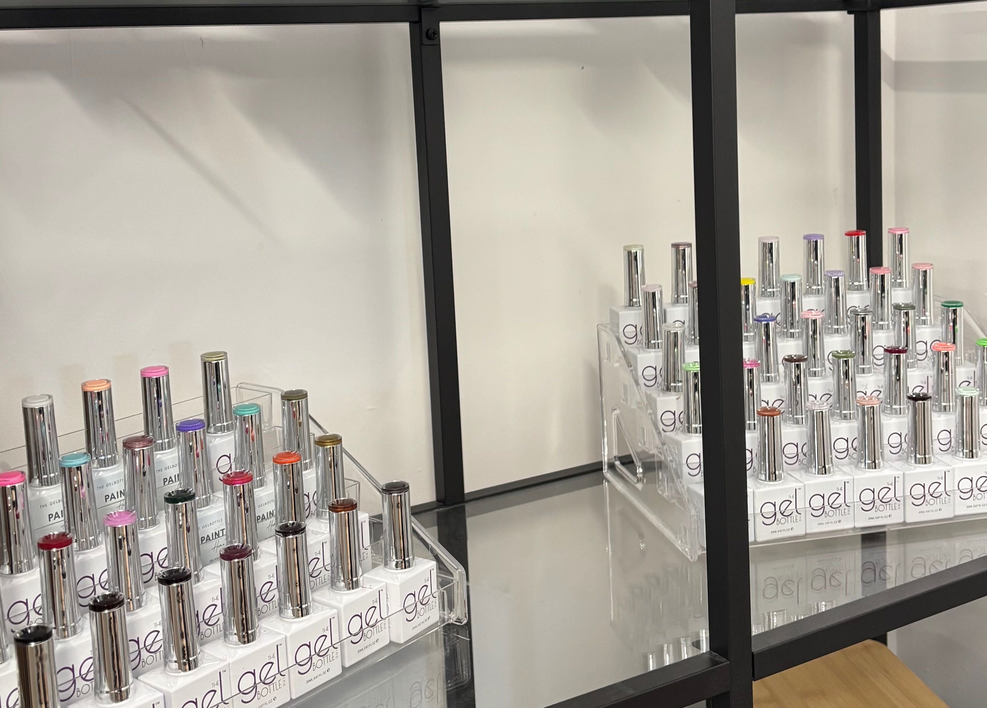 Vibrant gel nail polish display at Nails By Cait, Darwen, England, GB, showcasing a variety of colors.
