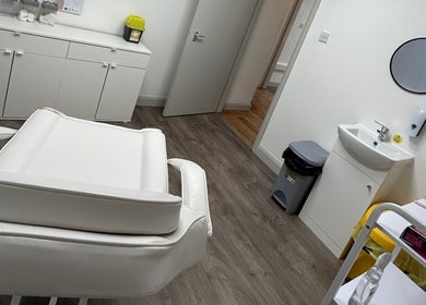 Modern treatment room at El Beaut Beauty and Aesthetics, Huddersfield, England, GB with sleek white furnishings.
