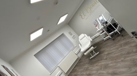 El Beaut Beauty and Aesthetics treatment room, Huddersfield, England, GB with a white chair and equipment.