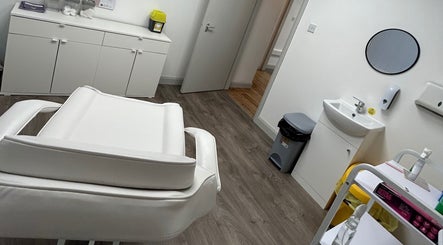 Tranquil treatment room at El Beaut Beauty and Aesthetics, Huddersfield, England, GB with a comfortable chair.