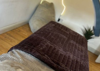 Relaxing treatment room at El Beaut Beauty and Aesthetics, Huddersfield, England, GB, featuring a plush treatment bed.