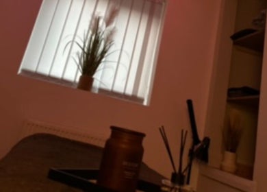 Relaxing treatment room at El Beaut Beauty and Aesthetics, Huddersfield, England, GB with soft lighting and calming decor.