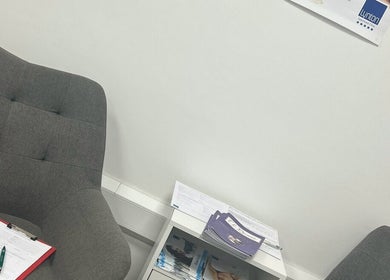 Relaxing seating area at El Beaut Beauty and Aesthetics, Huddersfield, England, GB with comfortable chairs.