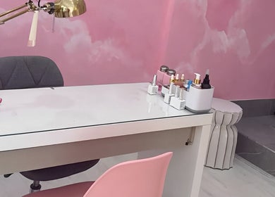 Nail service desk at Goddess Beauty Boutique, Guisborough, England, GB, with pink decor and beauty products.