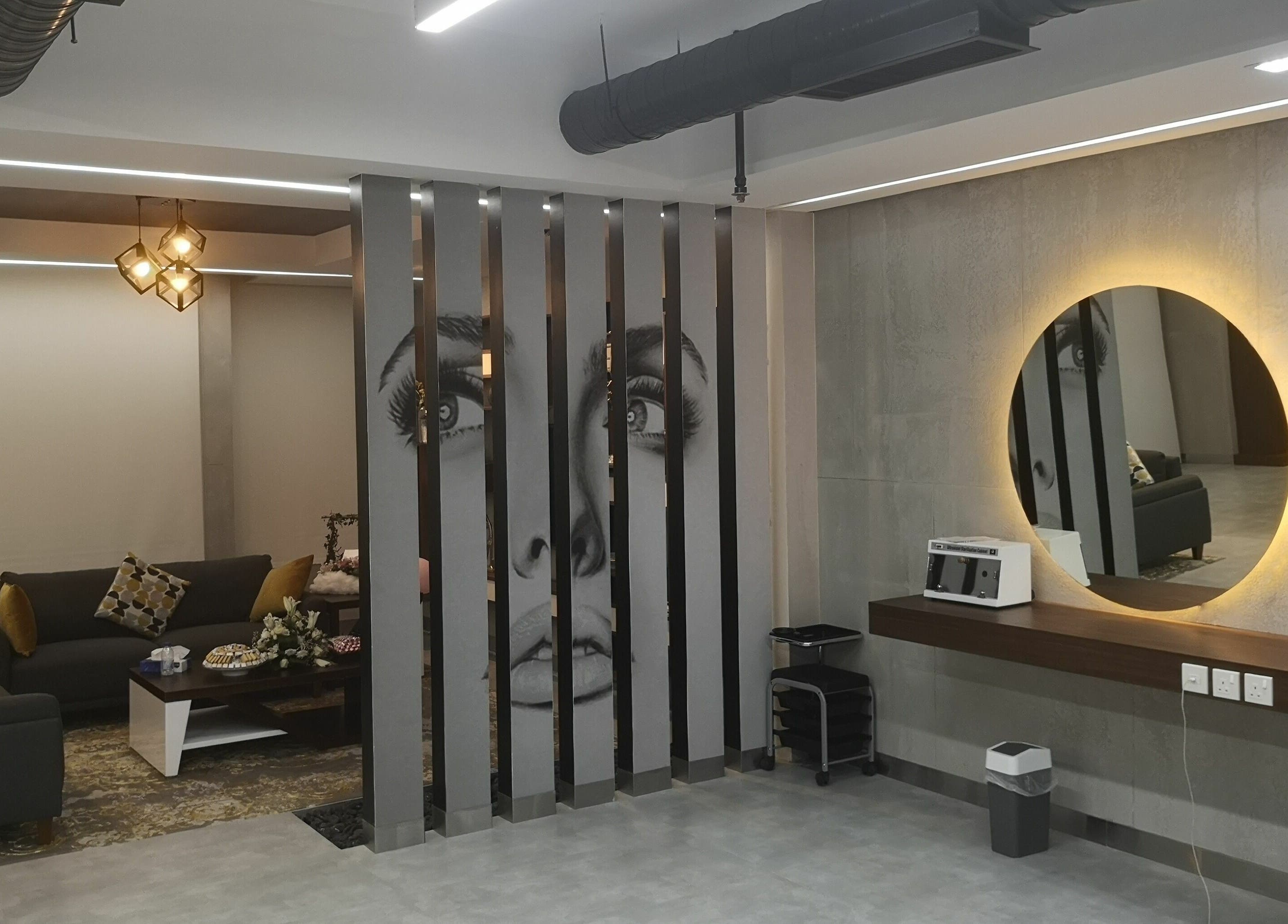 Chic interior of Bellezza Lounge in Riyadh, featuring modern décor and illuminated mirrors.