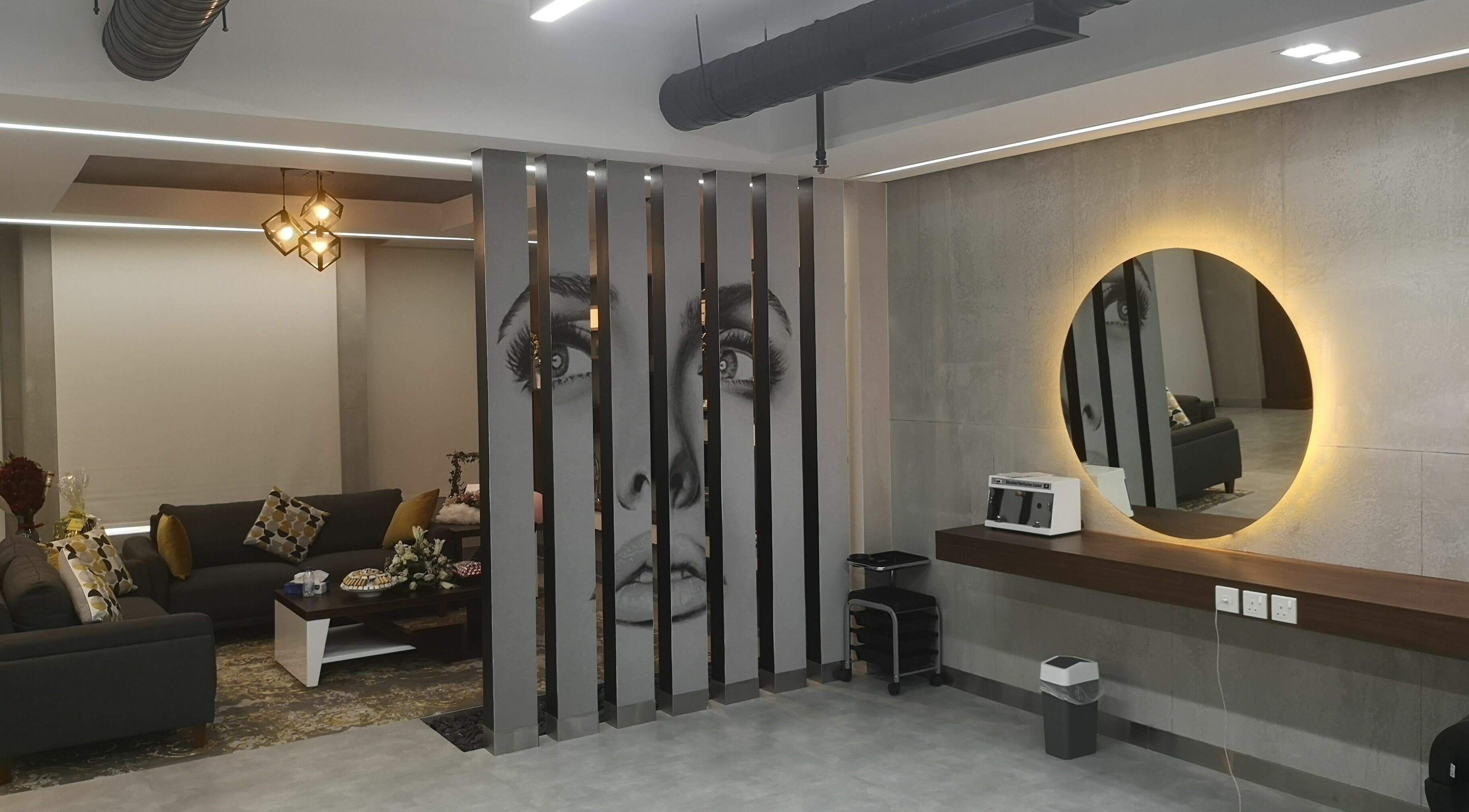 Chic interior of Bellezza Lounge in Riyadh, featuring modern décor and illuminated mirrors.