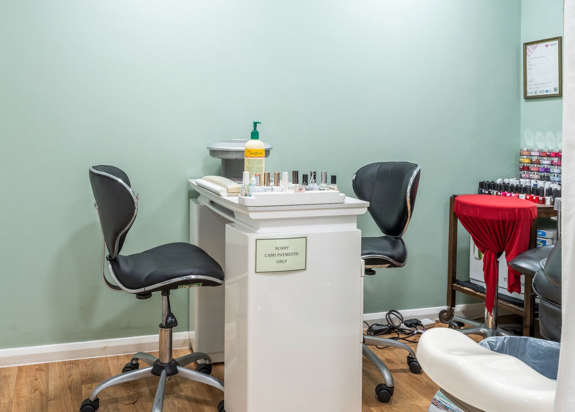Cozy nail salon at Lisa Hauck, London, England, GB showcasing a modern manicure station.