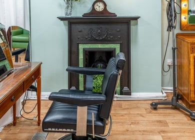 Charming vintage beauty corner at Lisa Hauck, London, England, GB with classic chair and ornate décor.