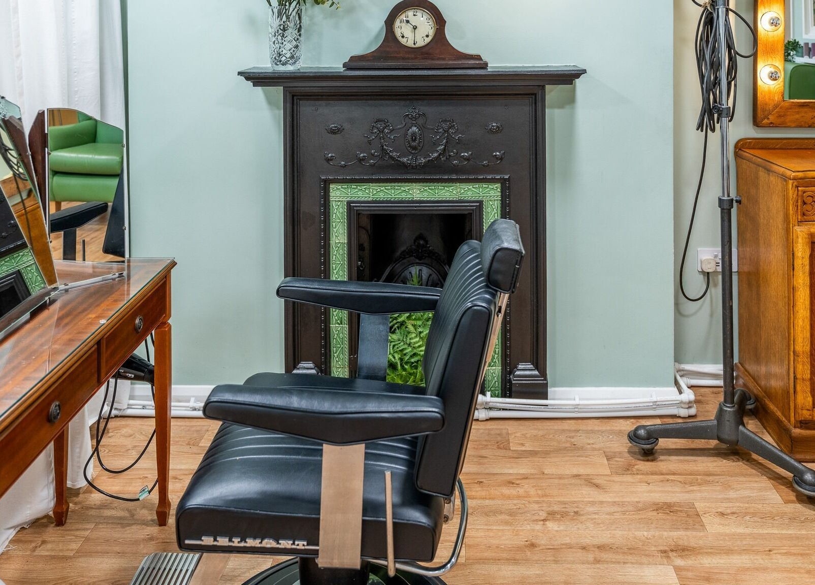Charming vintage beauty corner at Lisa Hauck, London, England, GB with classic chair and ornate décor.