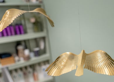 Elegantly crafted golden bird decor at Lisa Hauck, London, England, GB, enhancing the space's calming ambiance.
