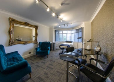 Stylish interior of treatment room at Hannah McCoy Clinic Leeds, Leeds, England, GB with chic decor and lighting.