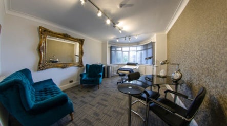 Stylish interior of treatment room at Hannah McCoy Clinic Leeds, Leeds, England, GB with chic decor and lighting.