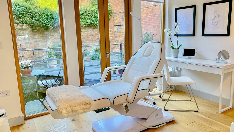 Luxurious treatment room at Bridge Street Skin Clinic in Hungerford, England, GB, featuring a plush chair.