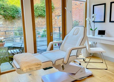 Luxurious treatment room at Bridge Street Skin Clinic in Hungerford, England, GB, featuring a plush chair.