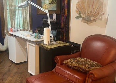 Cozy beauty station at Mayra Elaine Beauty, Merrillville, Indiana, US, featuring a plush leather chair and elegant decor.