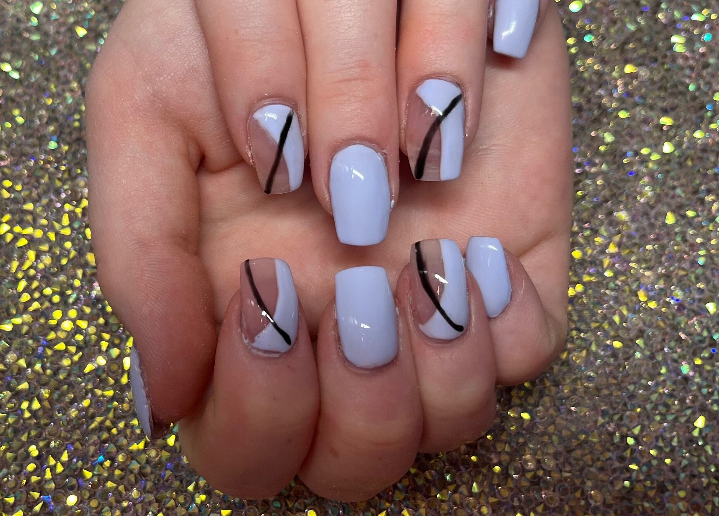 Stylish manicure at Twinkle Toes and Fingers & Aesthetics in Taverham, England, GB showcasing sleek nail art.